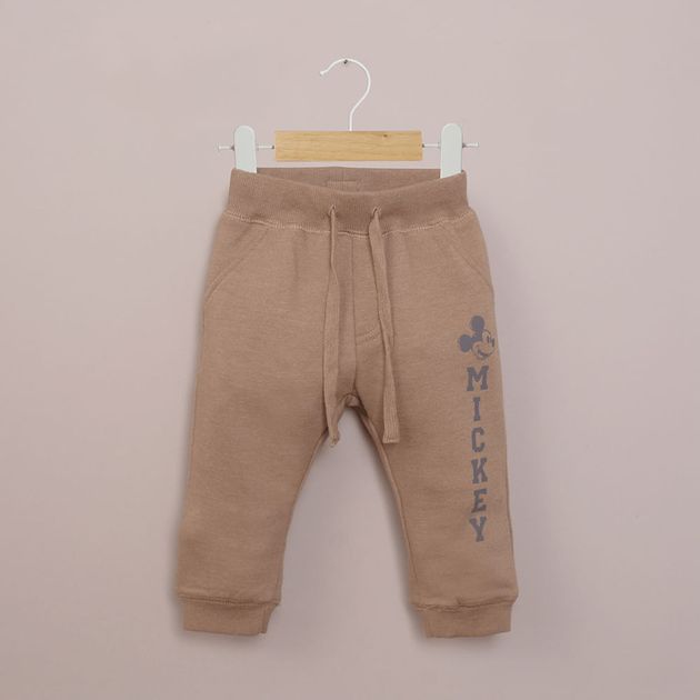 Pantalon de buzo beige disney de niño